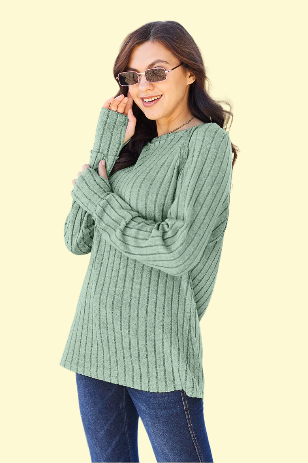 Light Green knit Top paired with blue jeans