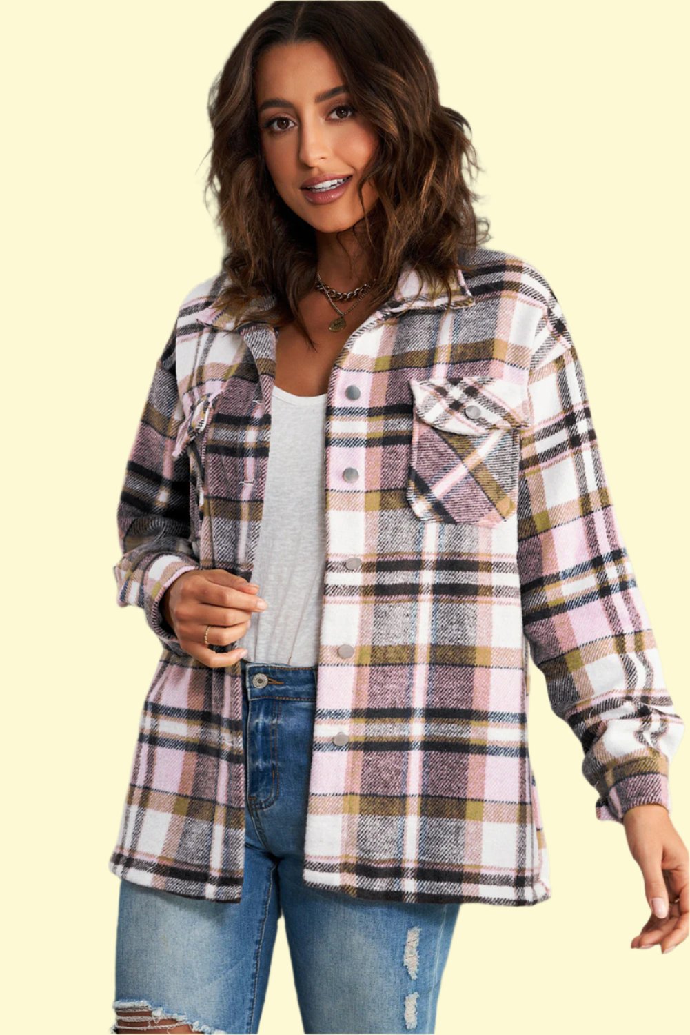 Model wearing a pink plaid shirt jacket