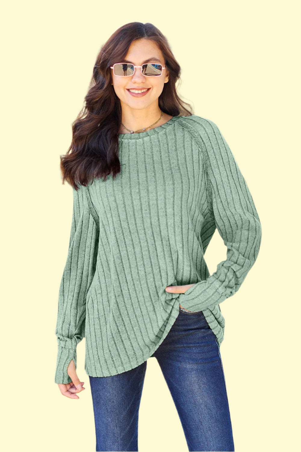 Close-up of the ribbed texture on the light green knit top