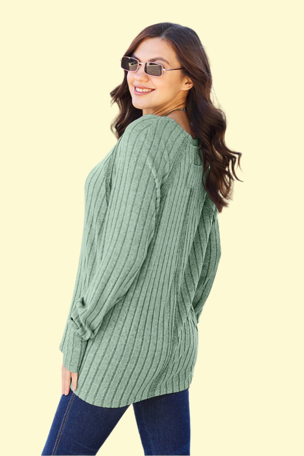 Side View of Model wearing light green knit top by West Closet