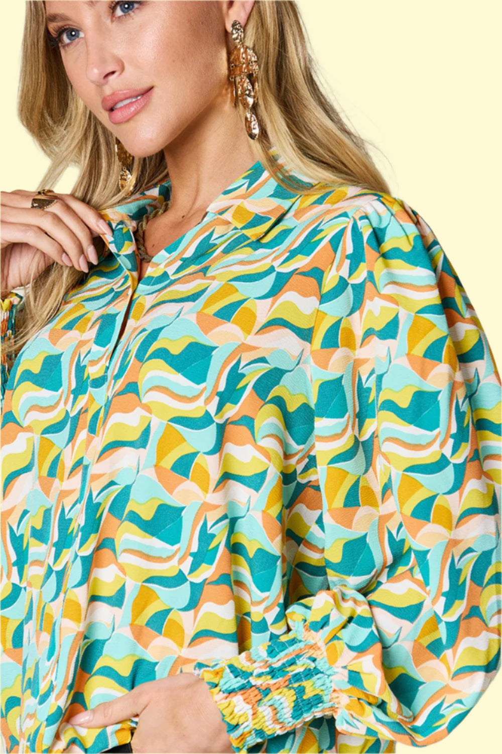 Fashion-forward printed blouse with smocking detail 